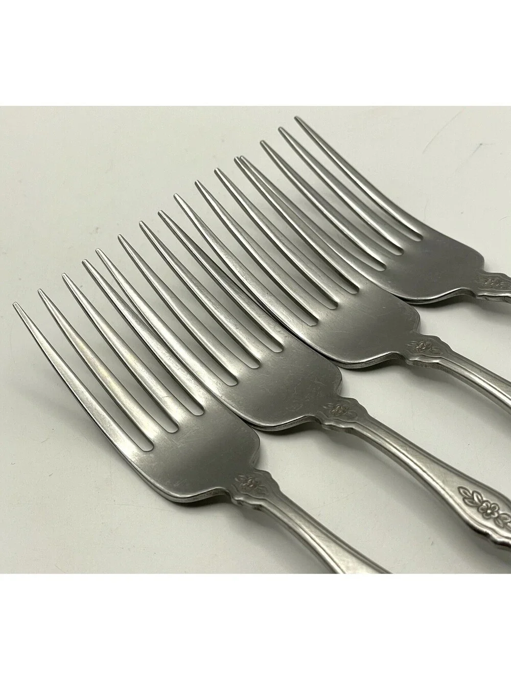 4- Oneida Community FANTASY Burnished Stainless Pierced Hndl Dinner Fork ~7.25”